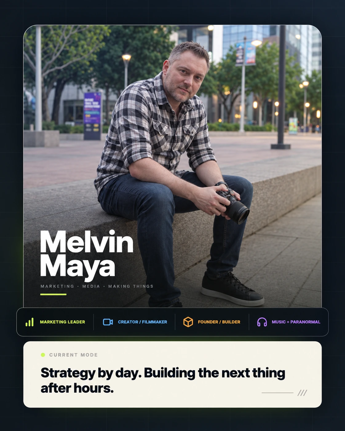 Melvin Maya seated outdoors in Houston holding a camera.